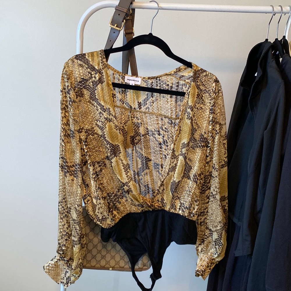 Purchased on Revolve. Super down snake skin body suit worn once